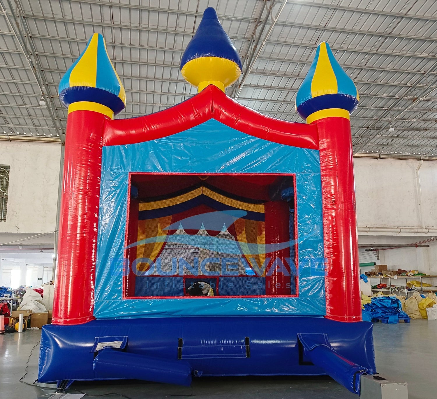 Carnival Commercial Grade Bounce House interior view displaying bright colors, mesh safety barriers, and Bounceway branding