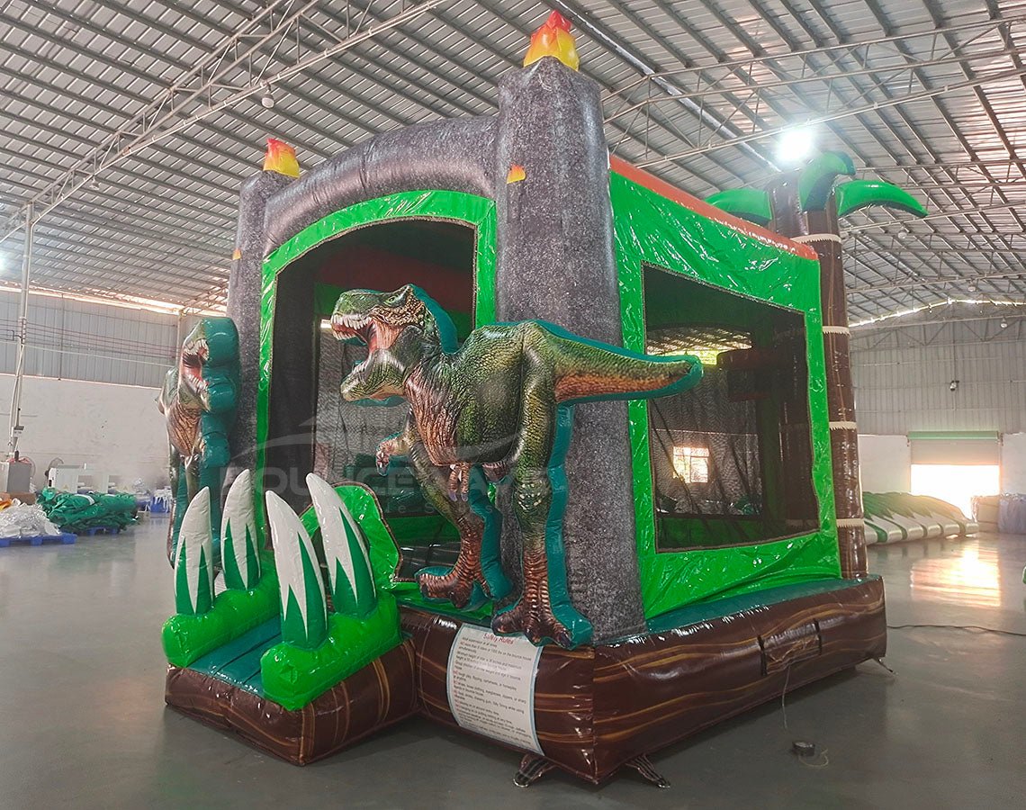 Dino Dive Commercial Grade Bounce House side view displaying lifelike T-Rex, grey castle walls, and green tropical elements