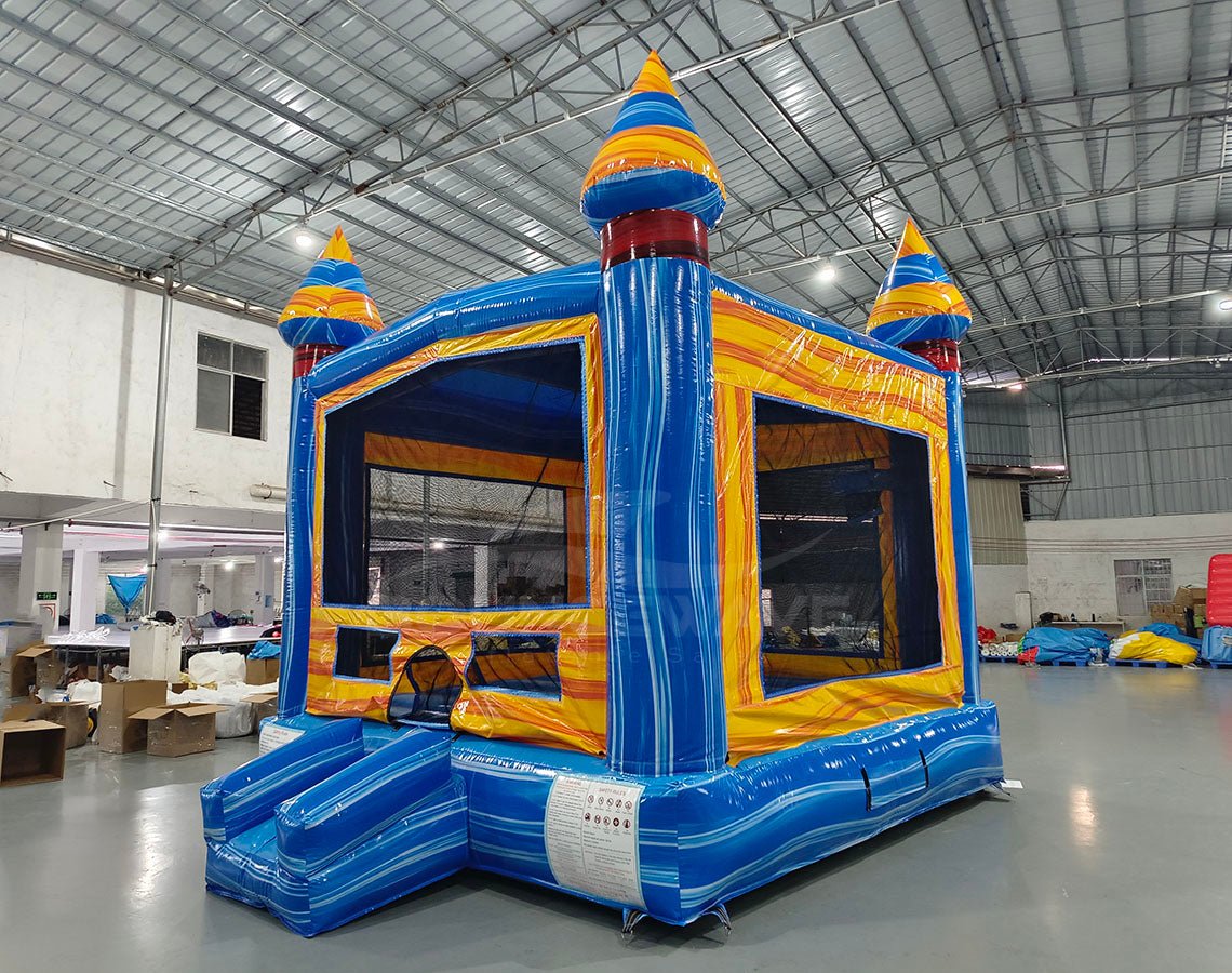 Fire and Ice Commercial Grade Bounce House side angle view displaying blue base, yellow walls, and multicolored spiral turrets