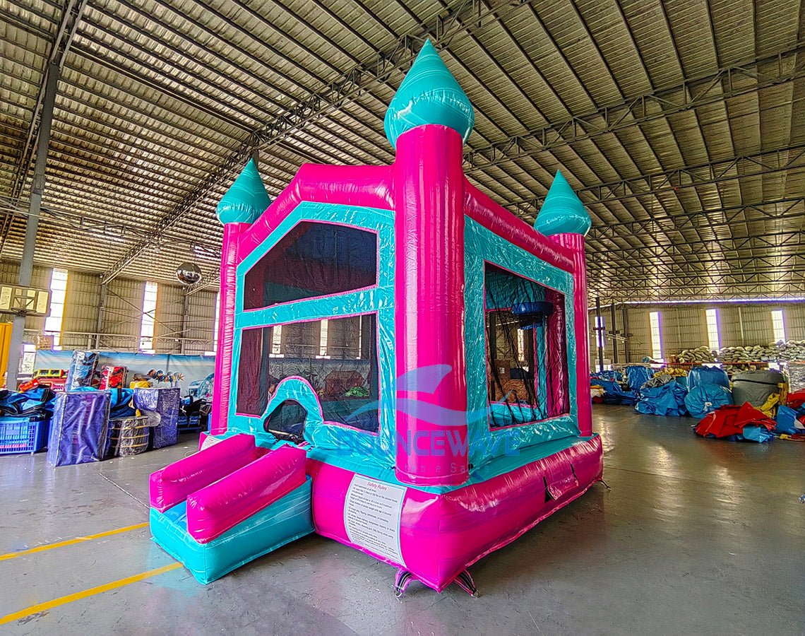 Pink/Teal Castle Bounce House - BounceWave Inflatable Sales