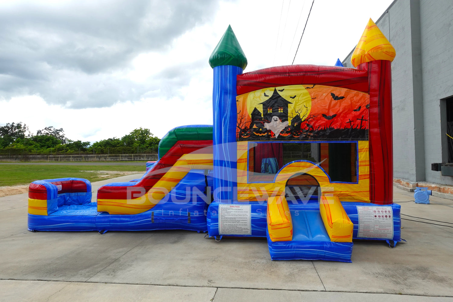 Seasonal Sampler Econo Panel Bounce House with Slide (Wet/Dry) - BounceWave Inflatable Sales
