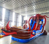 Side view of Tentacle Typhoon hybrid water slide showing pirate ship design with octopus tentacles, dual blue sliding lanes, and pirate flag decorations.