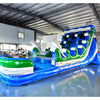 Large inflatable water slide with ocean theme, featuring blue sliding lanes, dolphin decorations, and a spacious splash pool area. The slide combines open and enclosed sections, set up in an indoor warehouse with metal roofing visible.
