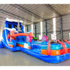 Large inflatable water slide with ocean theme, featuring blue sliding lanes, shark decorations, and a spacious splash pool area with octopus tentacles. The slide combines open and enclosed sections, set up in an indoor warehouse with metal roofing visible.