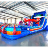 Large inflatable water slide with ocean theme, featuring vibrant blue colors, shark and stingray decorations, and a spacious splash pool area with octopus tentacles. The slide combines open and enclosed sections, set up in an indoor warehouse with metal roofing visible.