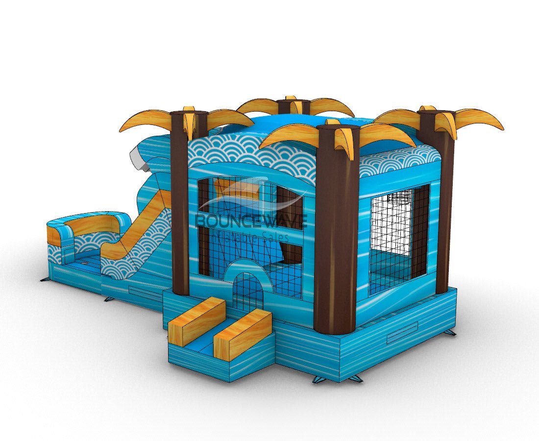 Tropical-themed inflatable combo featuring a large wave-shaped structure with dual slides. The main body is blue with white wave patterns, brown palm tree pillars, and yellow palm fronds on top. Includes a bounce house area with mesh windows, a curved slide, and a splash pool. Set against a white background, showcasing its beach-inspired design.