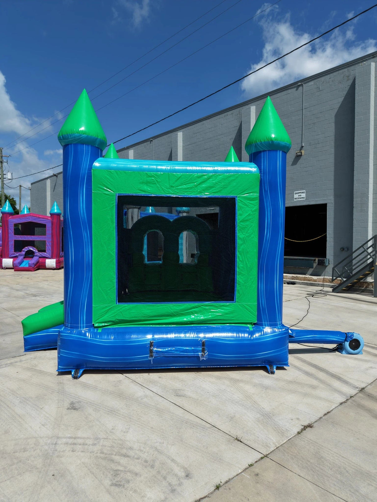 AquaBolt PowerPlay Dual Lane Bounce House with Slide Combo - BounceWave Inflatable Sales