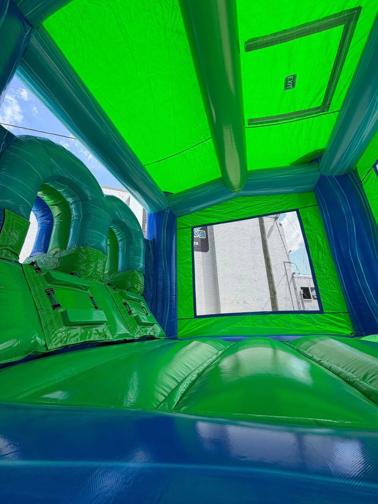 AquaBolt PowerPlay Dual Lane Bounce House with Slide Combo - BounceWave Inflatable Sales