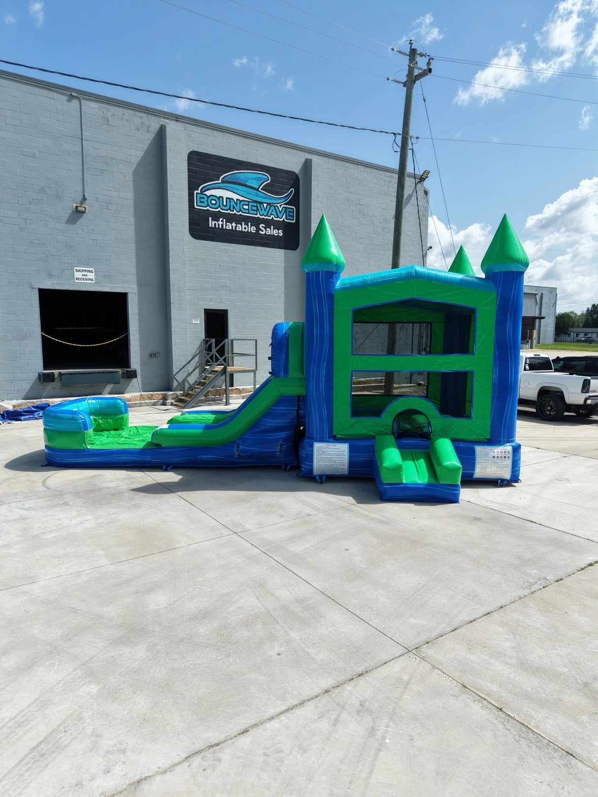 AquaBolt PowerPlay Dual Lane Bounce House with Slide Combo - BounceWave Inflatable Sales