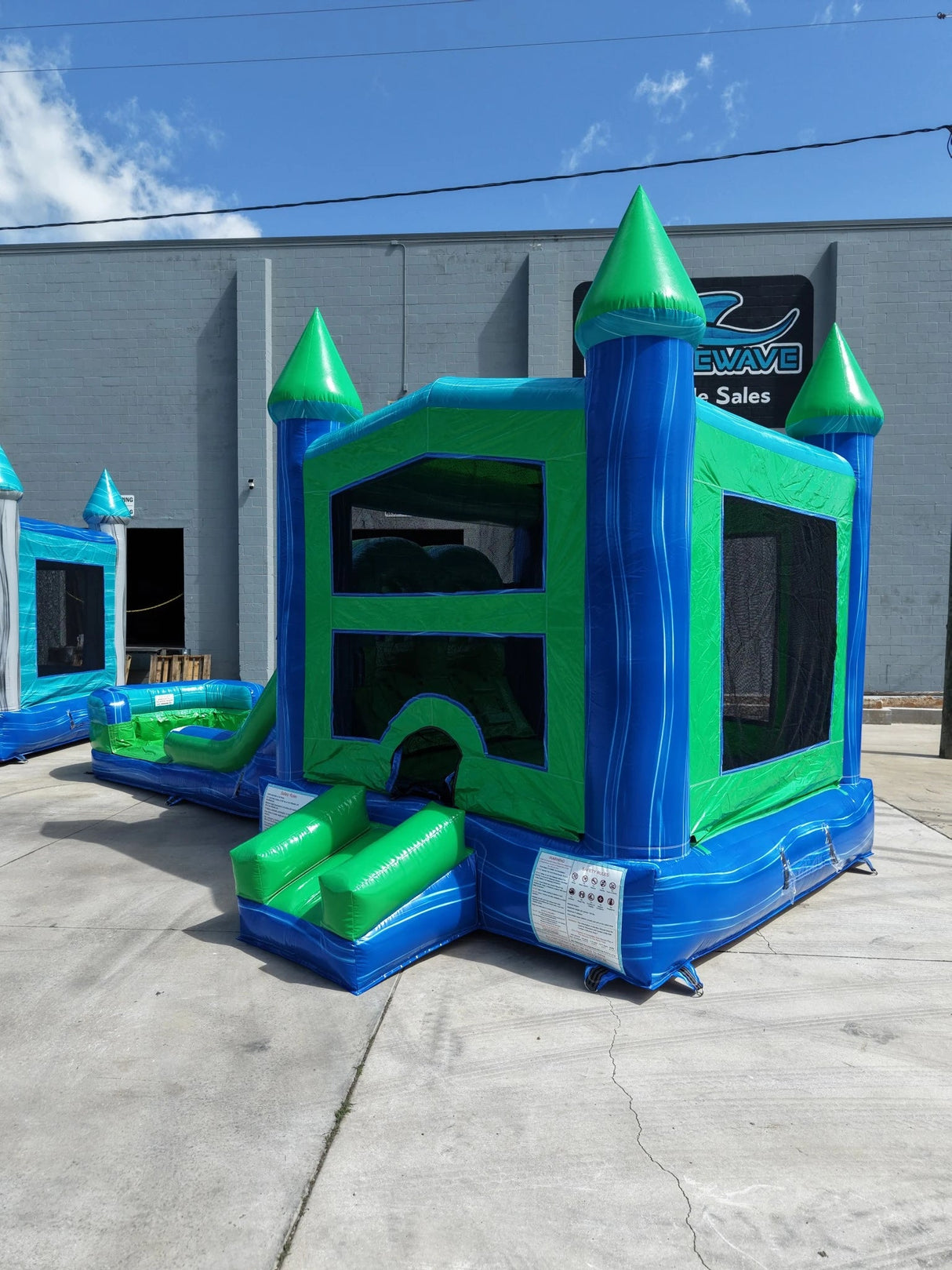 AquaBolt PowerPlay Dual Lane Bounce House with Slide Combo - BounceWave Inflatable Sales