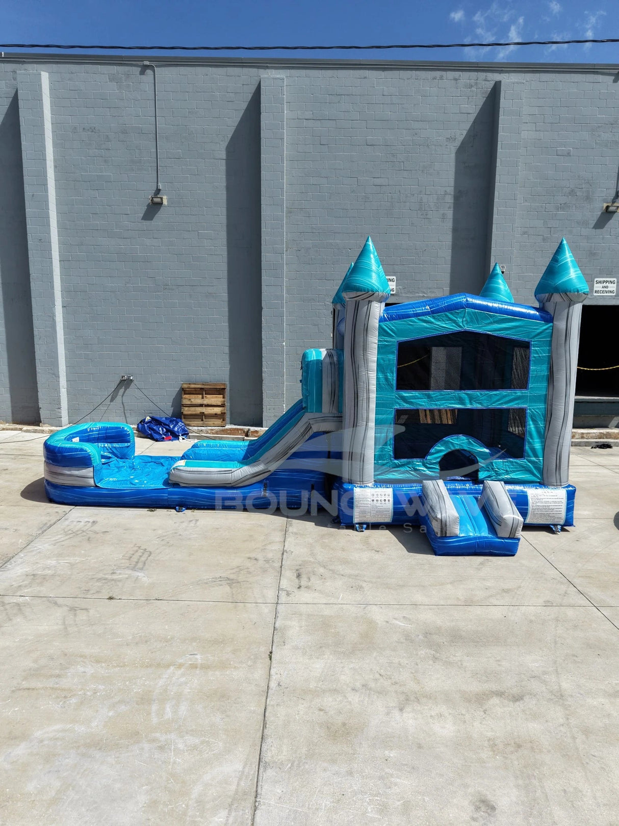 Bahama Blast PowerPlay Dual Lane Bounce House with Slide Combo - BounceWave Inflatable Sales