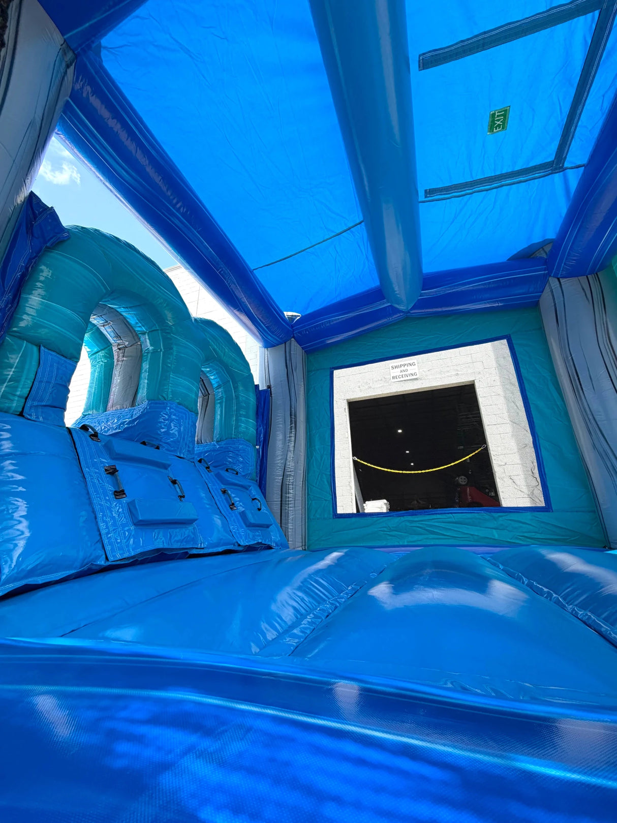 Bahama Blast PowerPlay Dual Lane Bounce House with Slide Combo - BounceWave Inflatable Sales