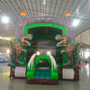 Dino Dive Commercial Grade Bounce House showcasing dual T-Rex figures, grey castle structure, and flame-topped turrets in indoor facility
