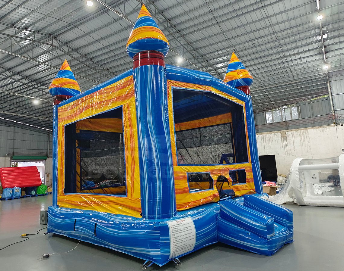 Fire and Ice Commercial Grade Bounce House side angle view displaying blue base, yellow walls, and multicolored spiral turrets
