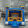 Fire and Ice Commercial Grade Bounce House in warehouse setting, showcasing blue and yellow design with spiral-topped towers
