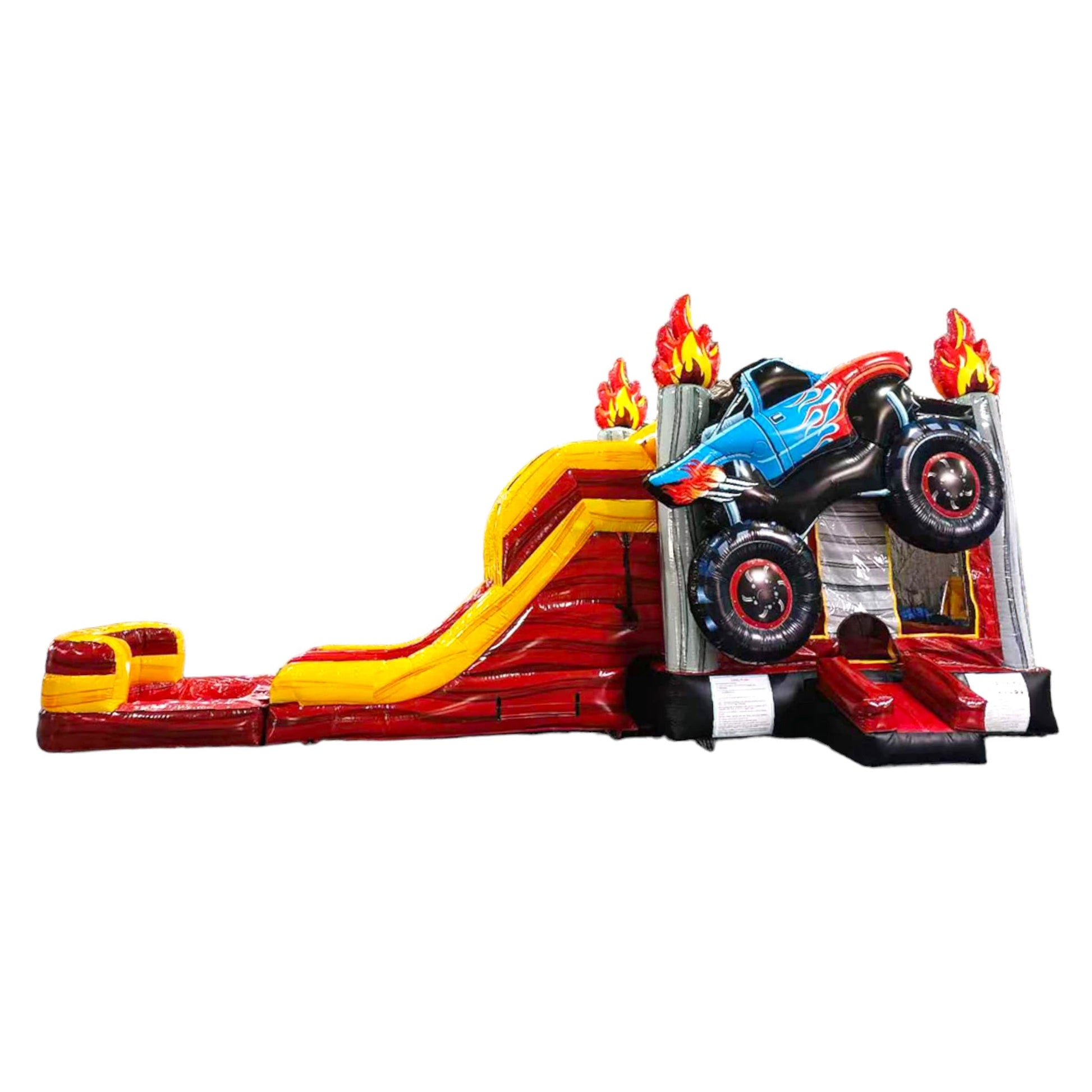 Side view of Monster Truck Dual Lane Commercial Inflatable Combo featuring a blue monster truck with flame decals mounted on top of a red and yellow base. The structure includes dual slides, one red and one yellow, leading to a splash pool area. Set against a white background, showcasing its design for commercial wet/dry use.