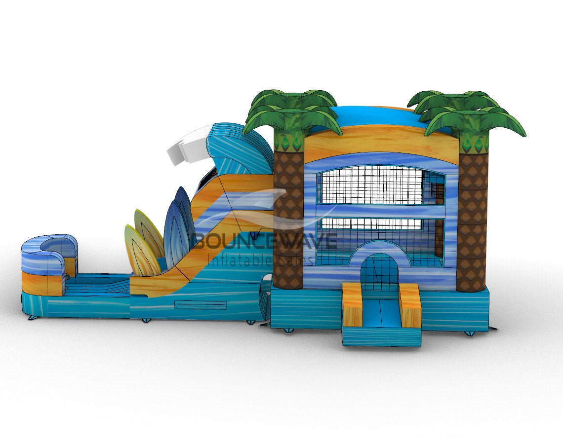 Large inflatable beach-themed combo featuring a bounce house with palm tree decorations, attached wave-shaped slide, and play area. The structure has vibrant blue, yellow, and green colors with surfboard designs. Four inflatable palm trees top the bounce house. Mesh windows allow visibility inside. Set against a white background.